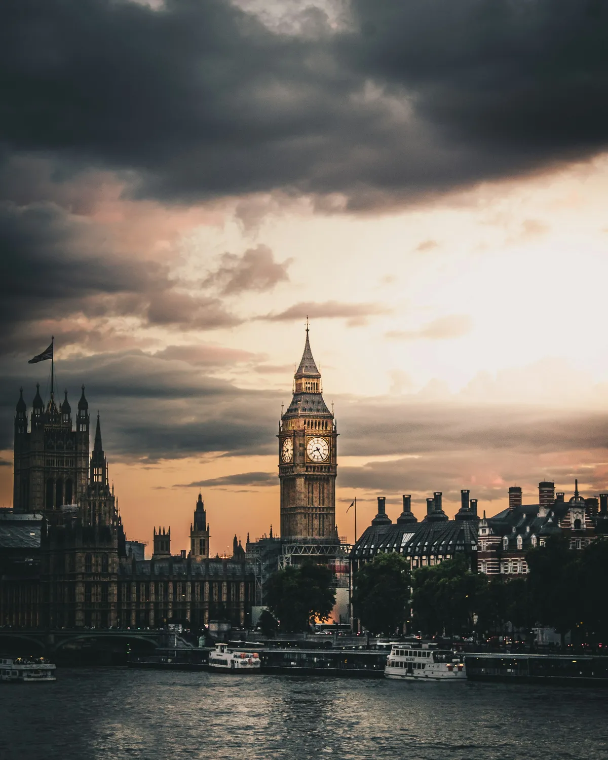 The Palace of Westminster at dusk, seen across the Thames.